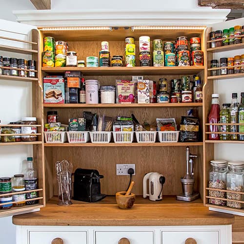 filled storage cupboard with foods