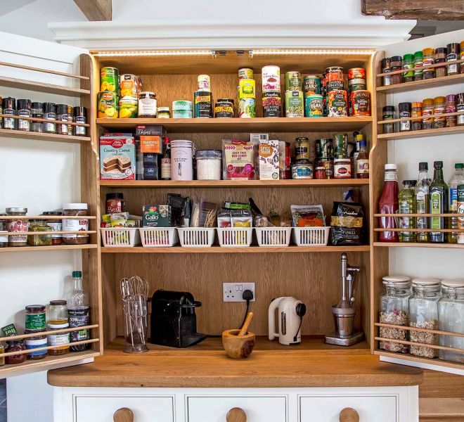 filled storage cupboard with foods