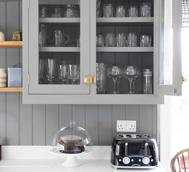 glass cupboard with toaster on worktop