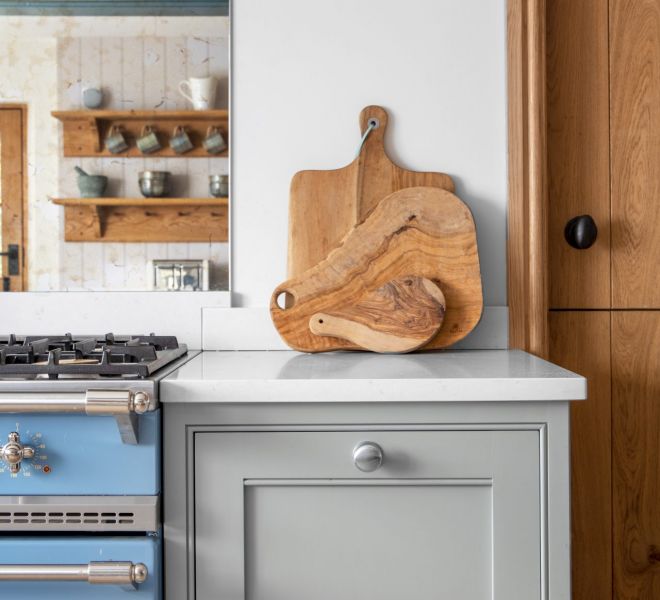 chopping boards resting on kitchen worktop