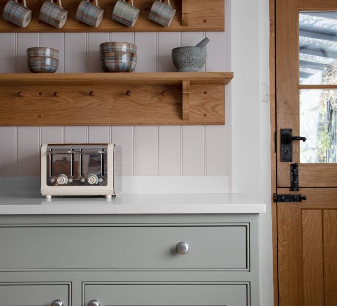 grey cabinets with wooden shelves