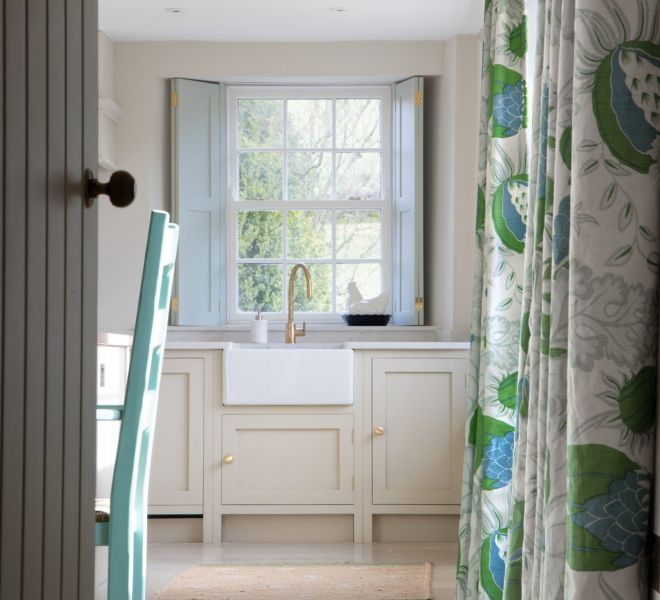 kitchen with a gold tap and withe windows